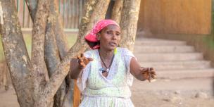 50 year old Hareyat Gebrelibanos and a mother of four from Tigray in Northern Ethiopia cleaning mitad* traditional griddle used for cooking bread at Meles IDP camp. Photo Credit: Zerubabel Tore/Oxfam 50 year old Hareyat Gebrelibanos and a mother of four from Tigray in Northern Ethiopia cleaning mitad* traditional griddle used for cooking bread at Meles IDP camp. Photo Credit: Zerubabel Tore/Oxfam