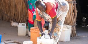 Tereza Joseph, 38, a community member in Abukhadra cleans her compound in Renk. Photo credit: Herison Philip Osfaldo/Oxfam