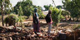 Twaibu Aufi and his wife 49-year-old wife Stevelia Aufi are seen on what used to be their house in the aftermath of Tropical Cyclone Freddy in Phalombe southern Malawi on Friday 24 March 2023. CREDIT: Thoko Chikondi / Oxfam