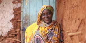 Madina Mohamed, program participant of the water project in Isiolo County where MID-P in partnership with Oxfam is constructing water point, borehole and tank and giving out 120 liters tank for storage fetches water in a river. Photo Credit: Eyeris Communications/Oxfam