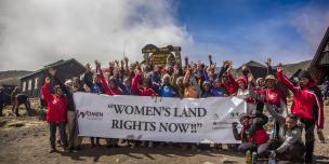 A group of rural women farmers and their supporters stand at the summit of Mount Kilimanjaro, using the climb as a powerful symbol of challenging and overcoming land inequalities around the world. Credit: Amy Bolger & Brad John-Davis, 2016