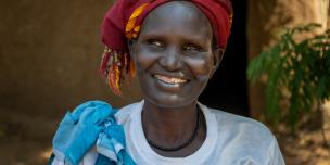 42-year-old Nyawouw Mayok, a female leader at Gambella refugee camp, engages in a discussion with a group of women outside her house, addressing pertinent issues affecting women in the camp. Photo credit: Petterik Wiggers/ Oxfam
