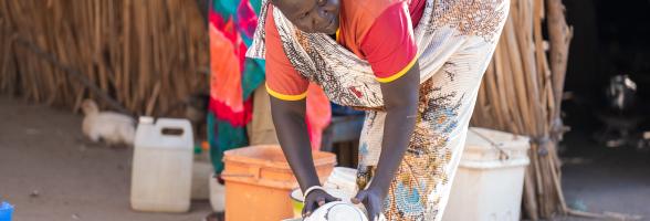 Tereza Joseph, 38, a community member in Abukhadra cleans her compound in Renk. Photo credit: Herison Philip Osfaldo/Oxfam