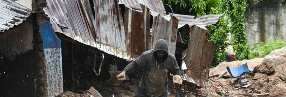A man in Chilobwe Township in Blantyre picking something from the rubble of his house after mudslides, heavy rains and winds destroyed it. Photo credit: Thoko Chikondi/ Oxfam A man in Chilobwe Township in Blantyre picking something from the rubble of his house after mudslides, heavy rains and winds destroyed it. Photo credit: Thoko Chikondi/ Oxfam
