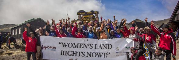 A group of rural women farmers and their supporters stand at the summit of Mount Kilimanjaro, using the climb as a powerful symbol of challenging and overcoming land inequalities around the world. Credit: Amy Bolger & Brad John-Davis, 2016