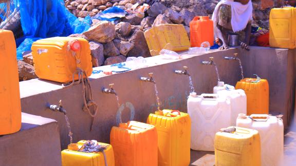 Water flows from multiple taps at Meshano spring water point in Birhan kebelle (Tigray, Ethiopia), helping families collect water more quickly.