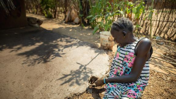 Nyalok, single mother of two and living as a refugee with a disability from a past accident, fled the turmoil of South Sudan in 2014. In Gambella, she is now making improvements to the small hut which she and her family calls home. Photo credit: Petterik Wiggers/ Oxfam