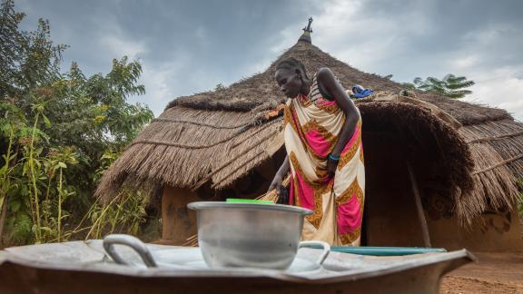 Nyalok, single mother of two and living as a refugee with a disability from a past accident, fled the turmoil of South Sudan in 2014. In Gambella, she is now making improvements to the small hut which she and her family calls home. Photo credit: Petterik Wiggers/ Oxfam