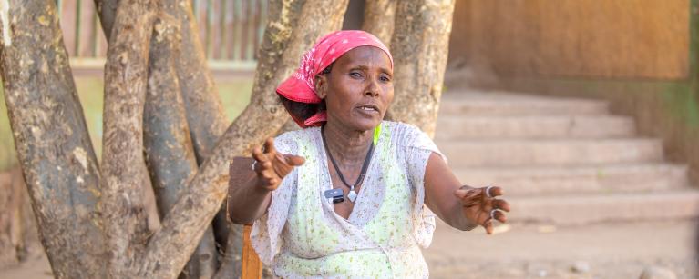 50 year old Hareyat Gebrelibanos and a mother of four from Tigray in Northern Ethiopia cleaning mitad* traditional griddle used for cooking bread at Meles IDP camp. Photo Credit: Zerubabel Tore/Oxfam