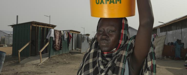 Achol Ring Tong Longar, 21 after arriving at the South Sudan border from war torn Sudan. Credit: Peter Caton/Oxfam