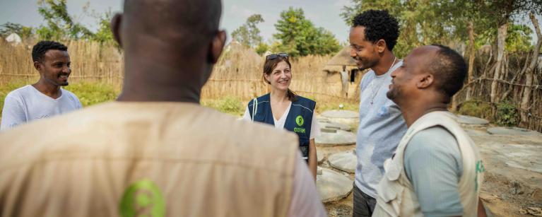 Oxfam Ethiopia and Oxfam Italy staff have a conversation at a waterpoint in Kule South Sudanese refugee camp, Gambella.