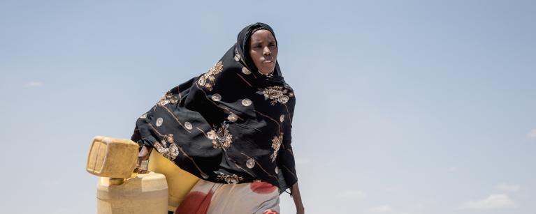 Seinab headed to the dam to fetch water in Badana, Kenya. Photo credit: Loliwe Phiri/Oxfam