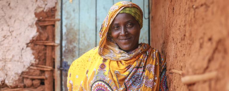 Madina Mohamed, program participant of the water project in Isiolo County where MID-P in partnership with Oxfam is constructing water point, borehole and tank and giving out 120 liters tank for storage fetches water in a river. Photo Credit: Eyeris Communications/Oxfam