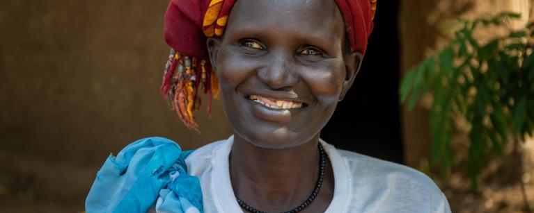 42-year-old Nyawouw Mayok, a female leader at Gambella refugee camp, engages in a discussion with a group of women outside her house, addressing pertinent issues affecting women in the camp. Photo credit: Petterik Wiggers/ Oxfam