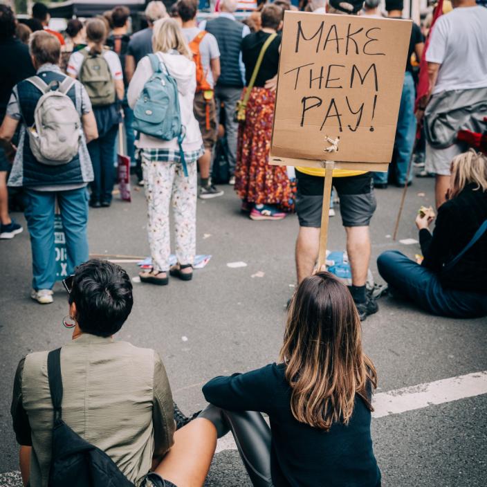 Oxfam joined thousands to march through central London, demanding that the government tax billionaires to pay more toward solving the climate crisis. Credit: Mark Chilvers / Oxfam