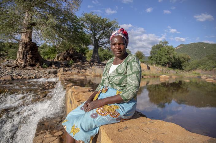 Sarah checks the water level at Nyanyadzi river,  Zimbabwe. She has been farming for 25 years. "A lot has changed since I started farming. The rain now comes late". Photo credit: Cynthia Matonhodze/Oxfam