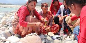 Local women from TROSA supported Women Empowerment Centers (WECs) test the water quality of the Mahakali river in far-western Nepal. Photo: Kamal Rawal RUWDUC Nepal