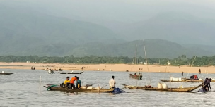 Labourers lifting sands from Jadukatha river in Sunajgonj. Backdrop: Meghalaya hills upstream.