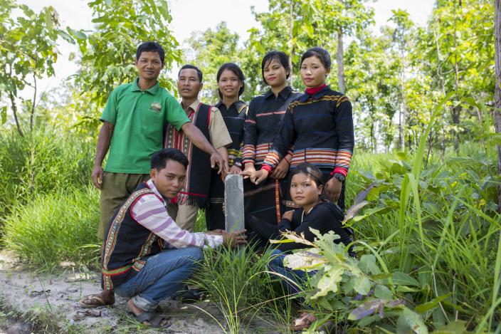 Sav Leat and the villagers show one of the concrete boundary markers in one of the community forests in Pa Tang village. Photo by Savann Oeurm/Oxfam