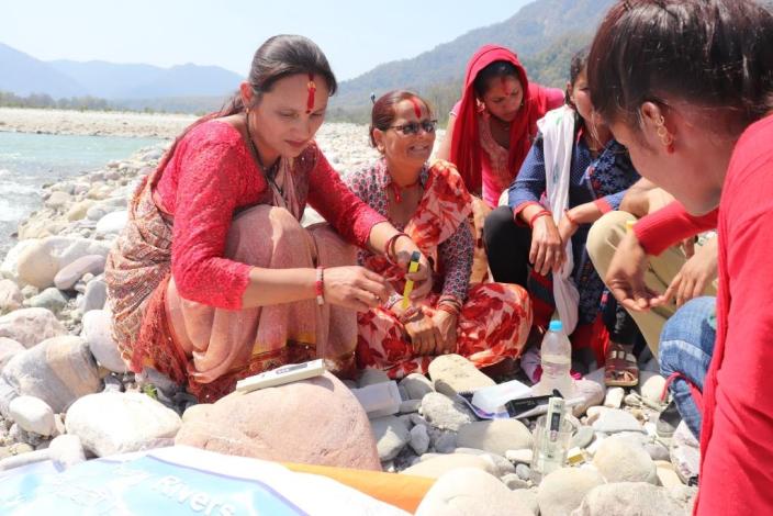 Local women from TROSA supported Women Empowerment Centers (WECs) test the water quality of the Mahakali river in far-western Nepal. Photo: Kamal Rawal RUWDUC Nepal