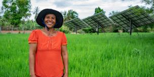 Thea Bou standing in front of Solar Irrigation System in Kandieng district which is managed and operated by the local communities. Thea Bou standing in front of Solar Irrigation System in Kandieng district which is managed and operated by the local communities.