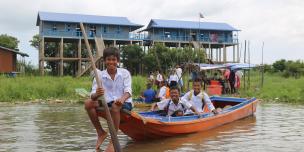 Students riding school boat back home after schooling at Kbal Taol Primary School