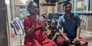 Sreymeas and her beautiful family posting for a picture inside their house. Photo: Oxfam