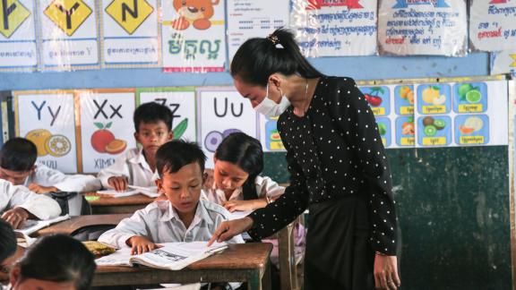 Chhenghun in fifth-grade class with teacher