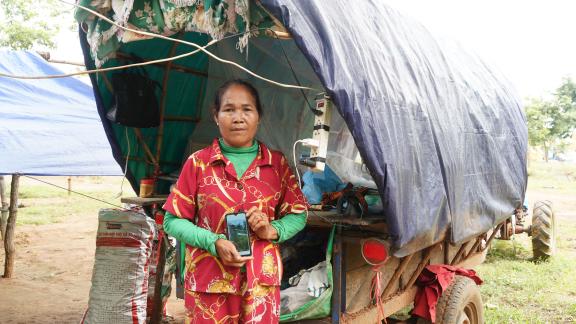 Ms. Yon Yeun showed her house that was destroyed by the bomb. She is now staying in her truck in the camp with her three grandchildren. Photo: Naratevy Kek/Oxfam