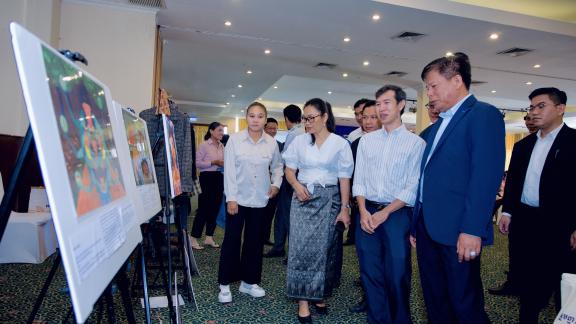 Front row from right: Deputy Director General of the General Department of the Ministry of Labor and Vocational Training Savuth Khieu, Oxfam Program Manager Khim Sok, Oxfam National Director Sophoan Phean and Srey Pov Thel during the gallery walk, viewing illustratrations of challenges faced by workers in the banana and rubber value chains. This was during a national dialogue on “Better Protection for Workers in Rubber and Banana Value Chains,“ October 31, 2024, Phnom Penh. Photo: Oxfam Front row from right: Deputy Director General of the General Department of the Ministry of Labor and Vocational Training Savuth Khieu, Oxfam Program Manager Khim Sok, Oxfam National Director Sophoan Phean and Srey Pov Thel during the gallery walk, viewing illustratrations of challenges faced by workers in the banana and rubber value chains. This was during a national dialogue on “Better Protection for Workers in Rubber and Banana Value Chains,“ October 31, 2024, Phnom Penh. Photo: Oxfam