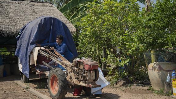 Ratana keeps a motorbike cart packed with essentials, ready in case his family must flee again.