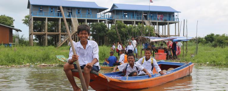 Students riding school boat back home after schooling at Kbal Taol Primary School