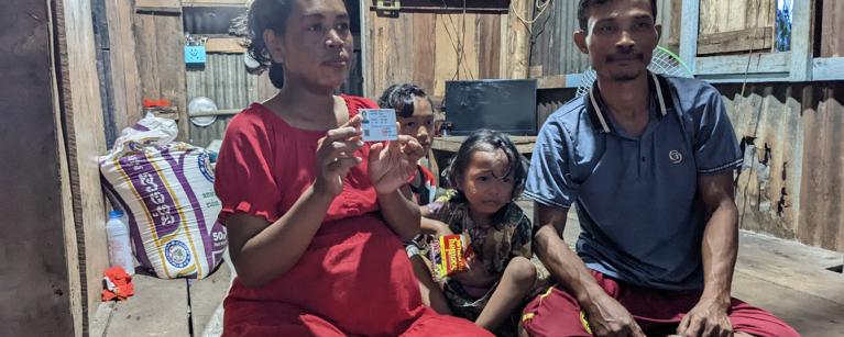 Sreymeas and her beautiful family posting for a picture inside their house. Photo: Oxfam