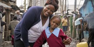 Doreen Muthoni, 38, a small scale trader with her daughter in Mukuru, an informal settlement in Nairobi, Kenya. Photo Credit: Katie Nelson