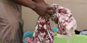 A domestic care worker cleaning clothes in Nairobi, Kenya. Photo Credit: Benson Guantai A domestic care worker cleaning clothes in Nairobi, Kenya. Photo Credit: Benson Guantai