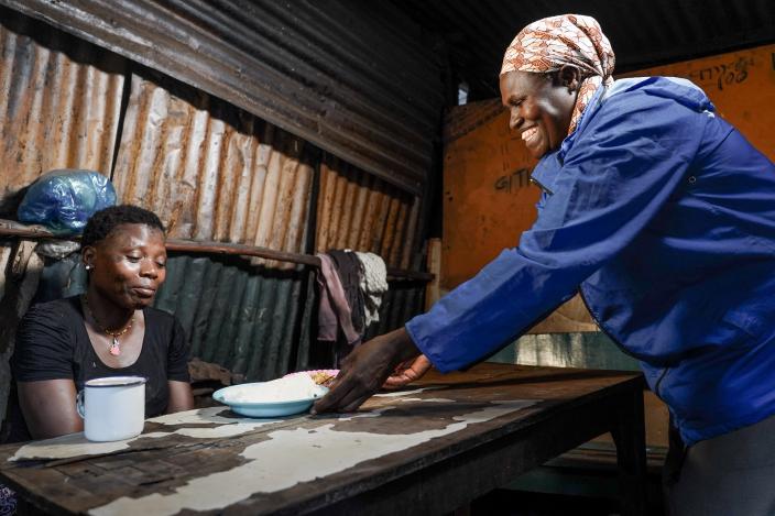 Martha serving the customer food 