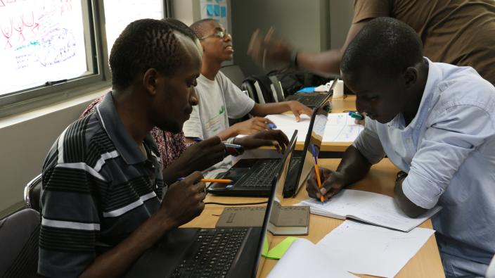 Hackers and CSO members discussing a budget monitoring system during a hackathon. Photo Credit: Joyce Kabue