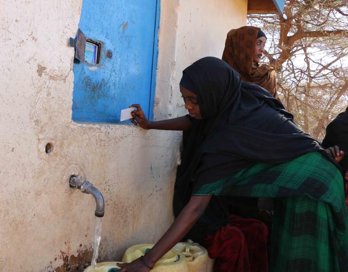 Women using the water ATM to fetch water in Wajir County. Photo Credit/Kevin Wabung'o/Oxfam