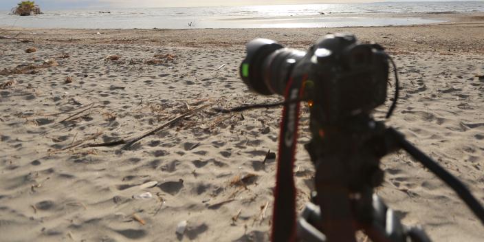 Camera set to capture shot of fishermen approaching the Lake Turkana shore. Photo Credit: Brian Inganga