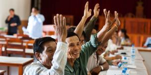 Oxfam vision and way to the future people raising their hands to claim their rights