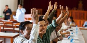 people raising their hands to claim their rights