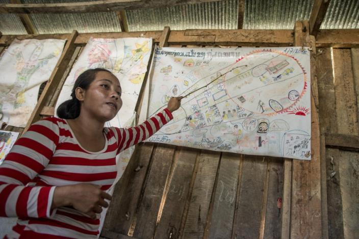 Vanthong explains the village group plan