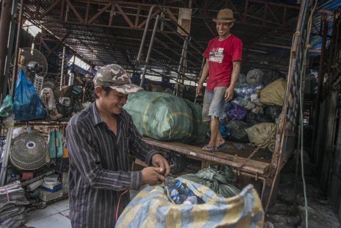 Packing and weighing garbage, Vientiane, Laos