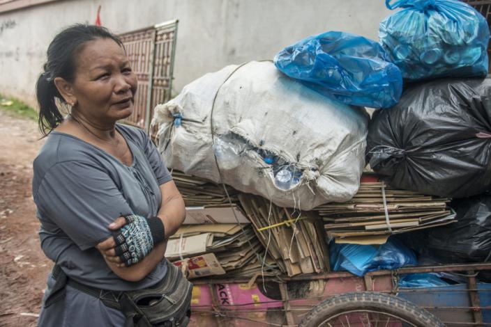 Ms. Thong shows her waste cart