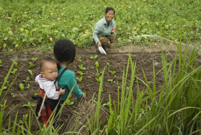 Gardening woman and child