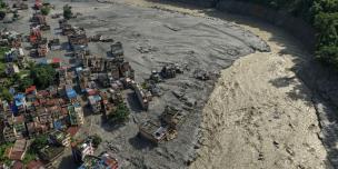 Aerial view of devastation and riverside settlements reduced to ruins in Trishuli Bazaar