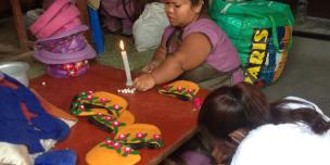 A woman making bag from felt