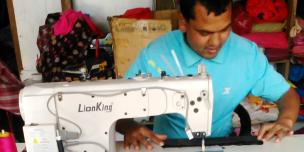Raju Bishwokarma with his new electric sewing machine Raju Bishwokarma with his new electric sewing machine
