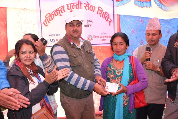 Bimala Nepali receiving citizenship certificate from Dhading's Chief District Officer, Umesh Kumar Dhakal. Photo by: Sarita Rai/Oxfam