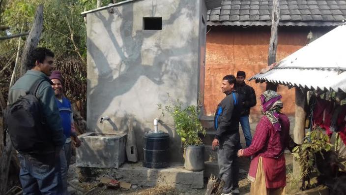 Santa Bahadur Ghimire (second from left), the proud pioneer of eco-san toilets - Credit: Sumeru Tripathee/Oxfam